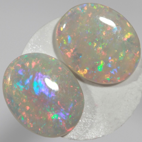 SOLID SEMI BLACK OPALS Matching pair, bright multicolours